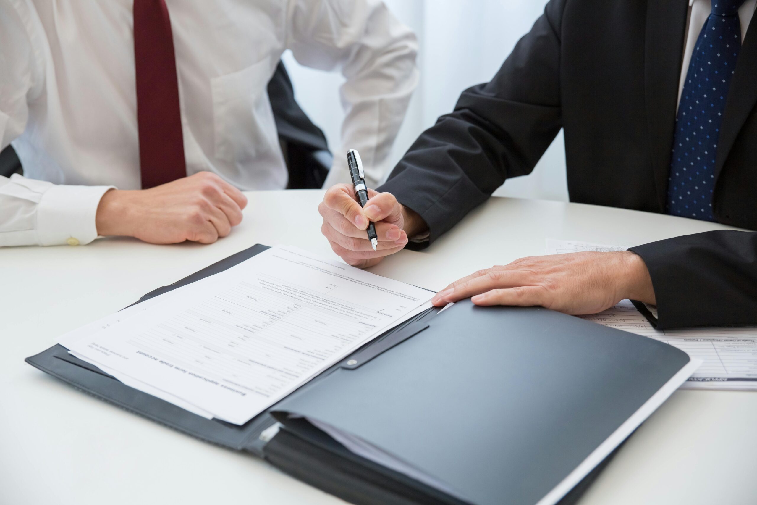 Injury lawyer discussing settlement options with client
