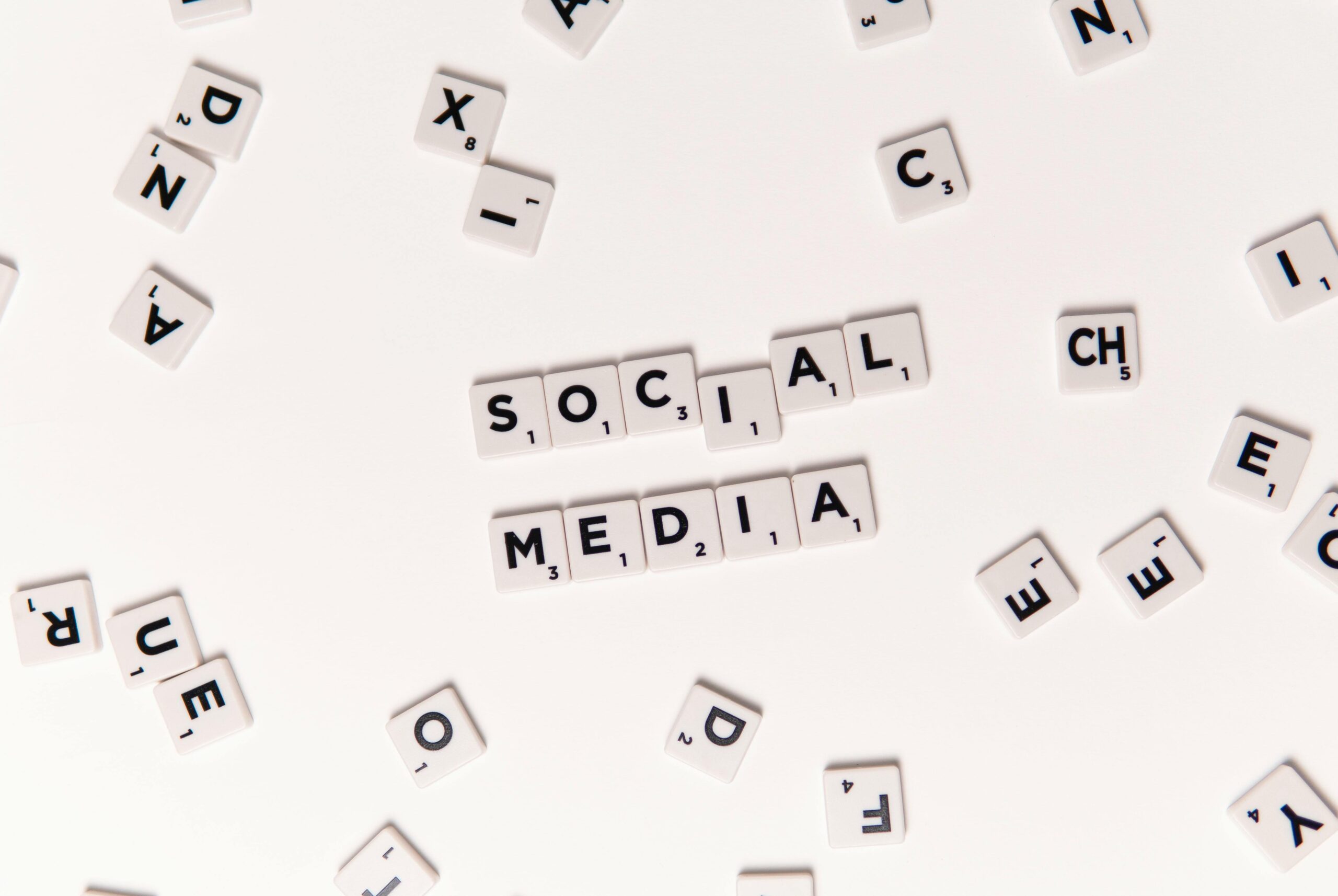 Teenager using smartphone with social media icons floating around the screen