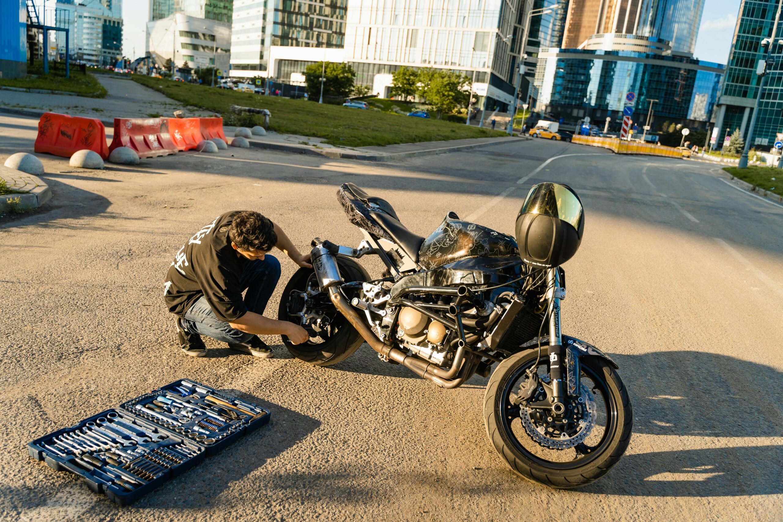 Who pays for my bike repairs after a collision – cyclist examining a damaged bicycle after an accident.